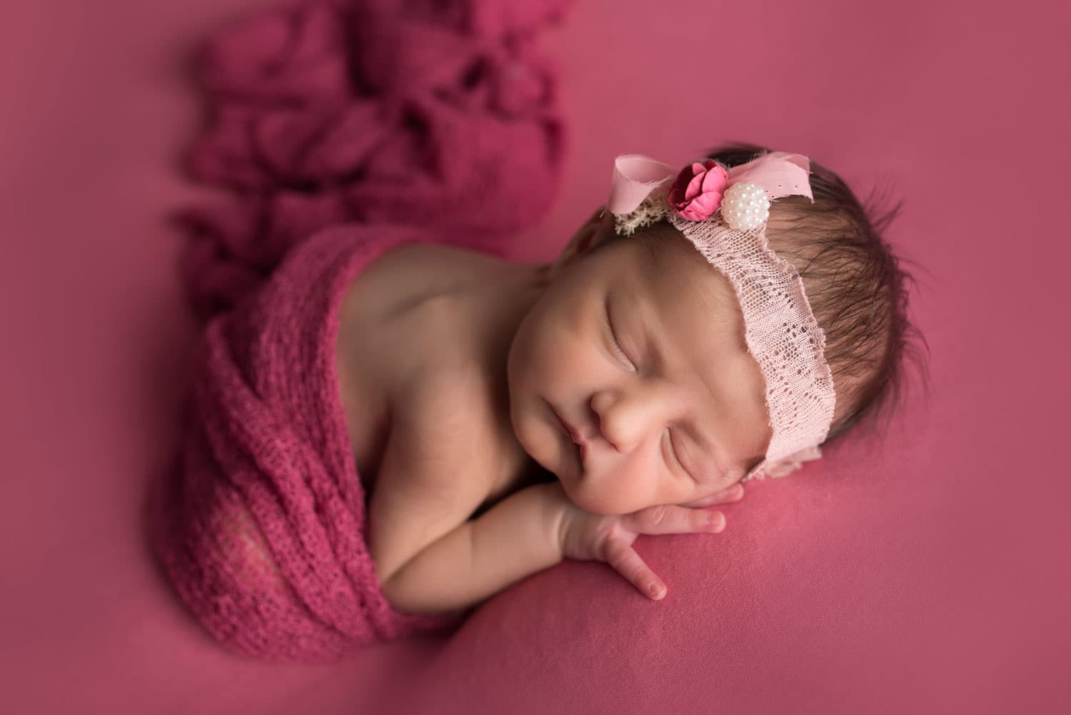 newborn baby on beanbag ping headband