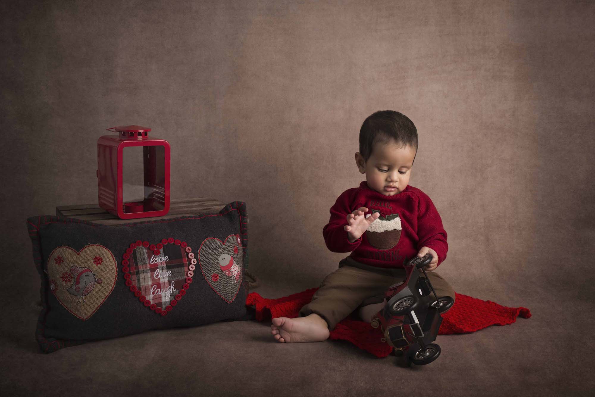 baby boy playingphotographed by Baby Photographer Manchester