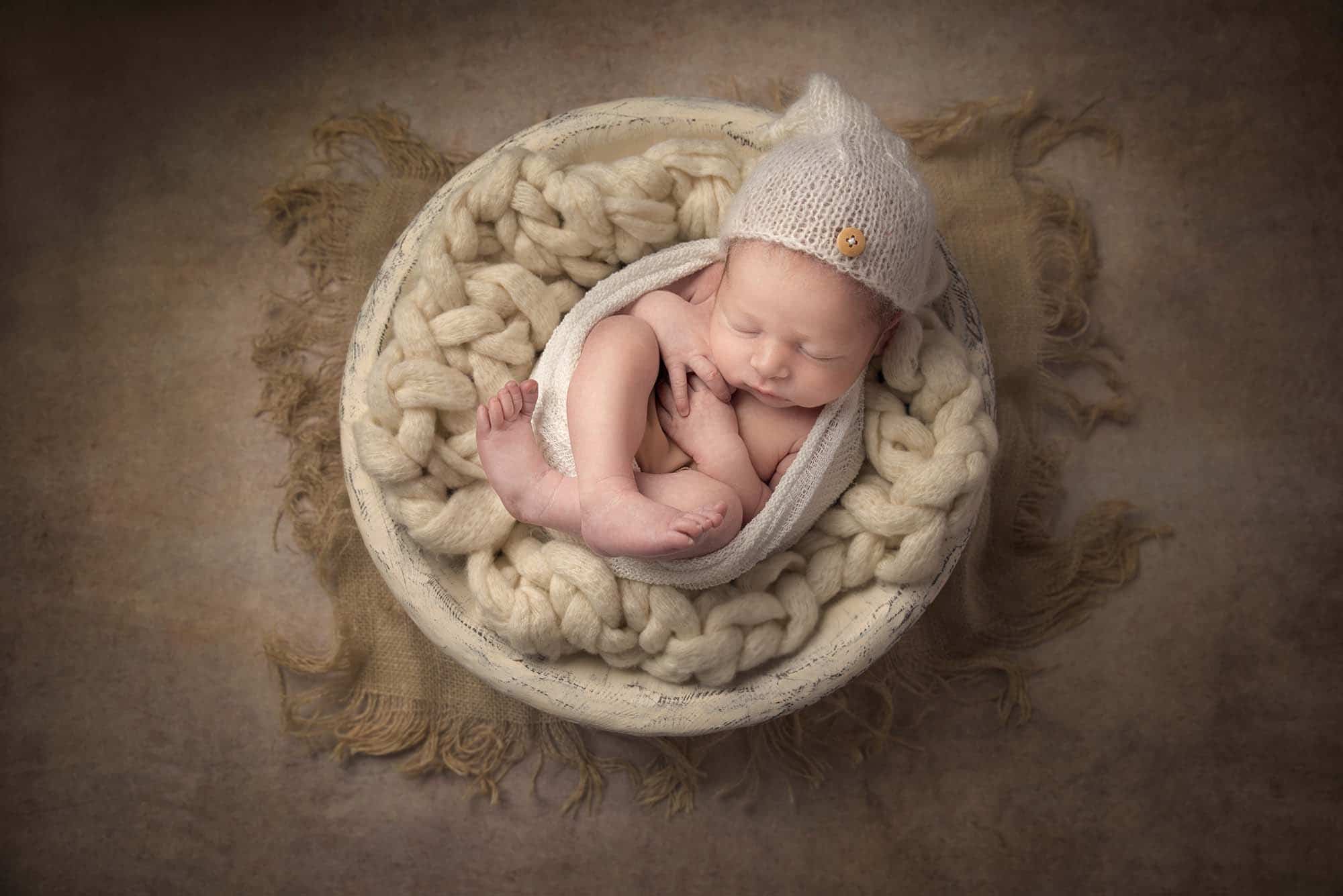 newborn baby boy in white bowl photographed by Newborn Photographer Cheshire