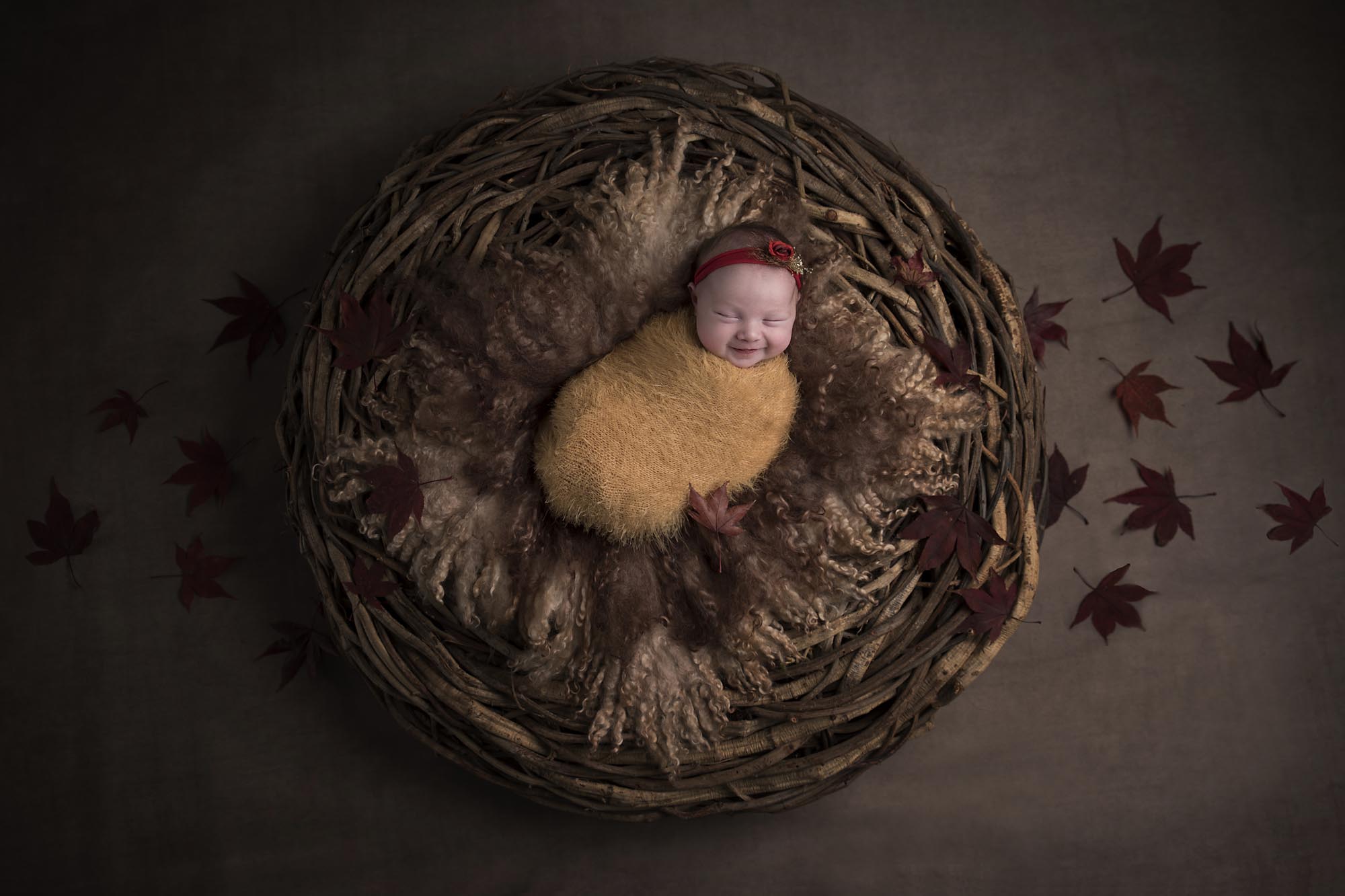 newborn girl with autumn set photographed by Newborn Photographer Cheshire