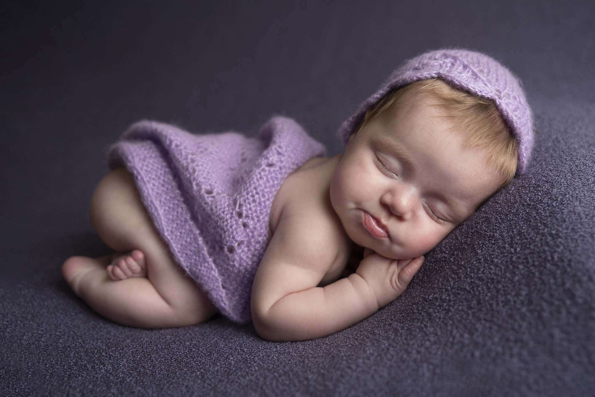 newborn girl in purple blanket photographed by Newborn Photographer Cheshire