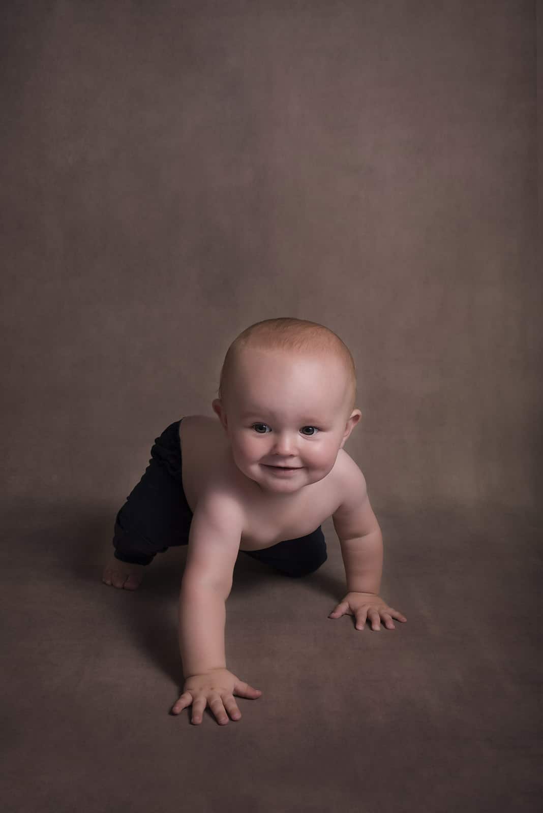 baby boy is crawling photographed by Baby Photographer Manchester