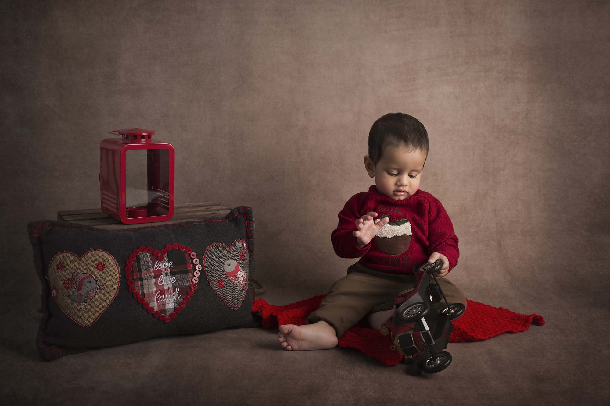 baby boy playing with toys photographed by Baby Photographer Manchester