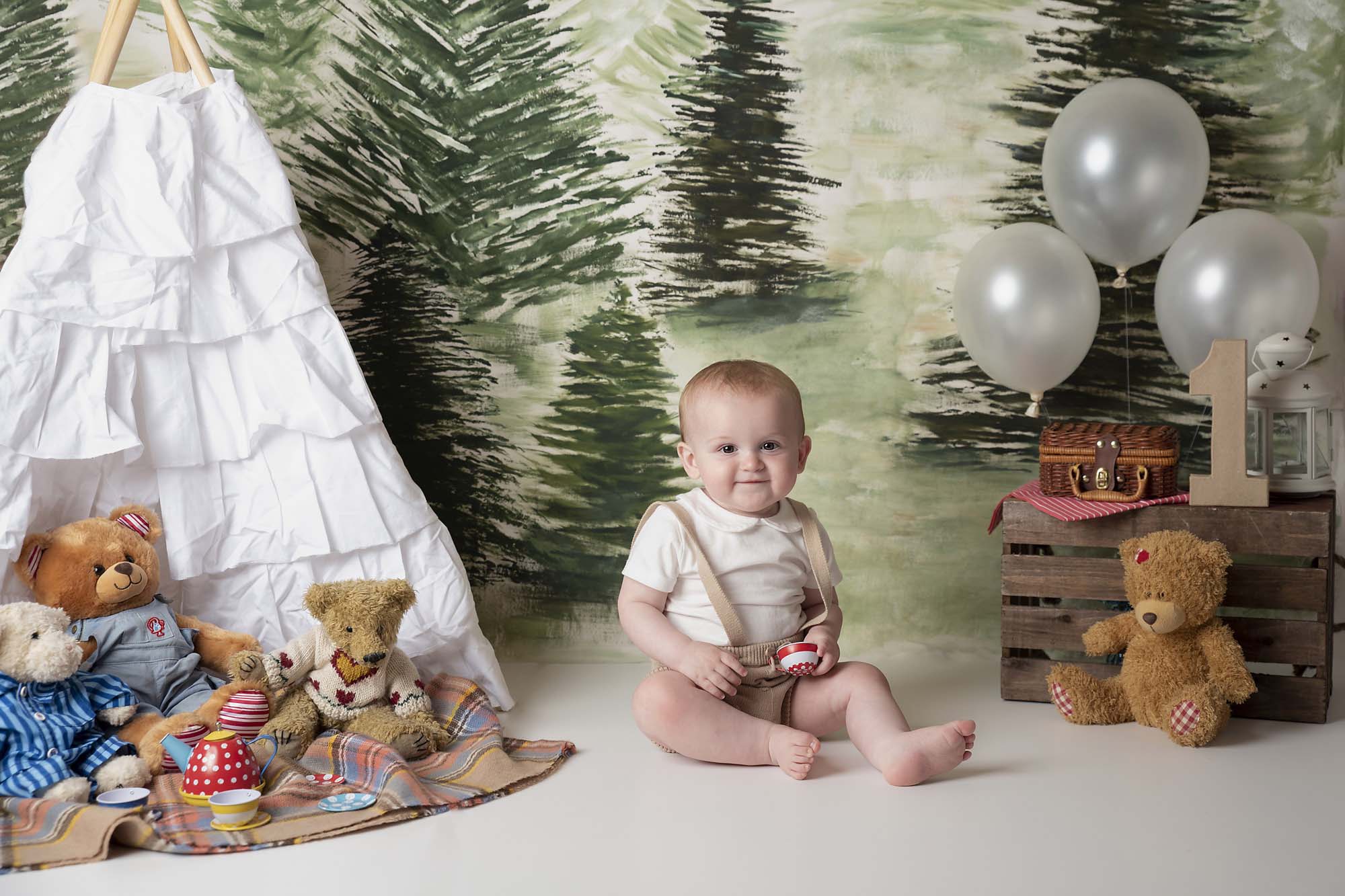 baby boy having a picknick in the forest photographed by Baby Photographer Manchester
