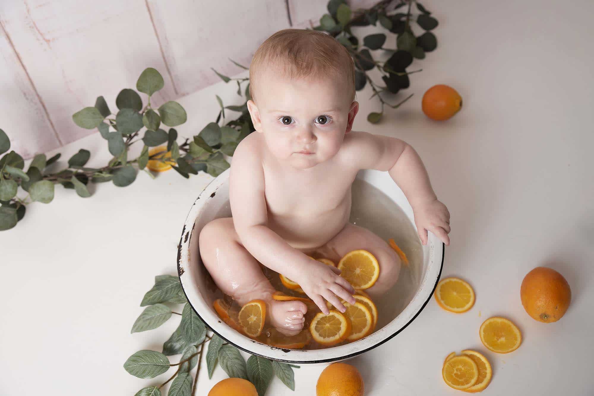 baby fruit splash with little boy photographed by cake smash photography Manchester
