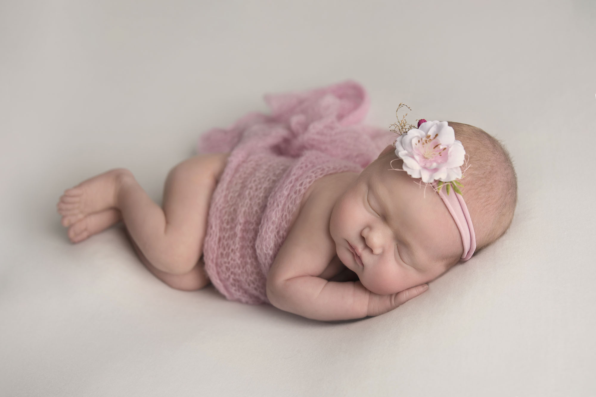 newborn baby girl in taco pose photographed by Newborn Photographer Cheshire